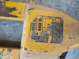 a close up of a yellow fork with a tag on it