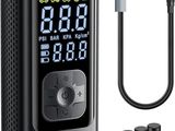a digital clock with a cable connected to it next to a charger