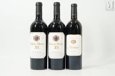 three bottles of wine sitting on top of a white table