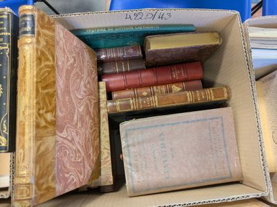 a box full of books sitting on a table