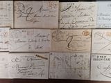 many old envelopes on a table with writing on them