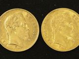 two gold sovereigns, one with the head of a man and one with a woman