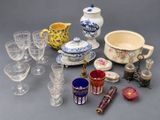 many different types of glassware sitting on a table