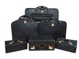 six pieces of black luggage sitting next to each other on a white surface
