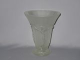a glass vase that is sitting on a table