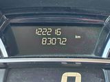 the dashboard of a car with a digital clock on it