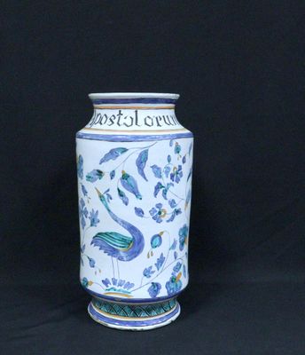a blue and white vase sitting on a black background