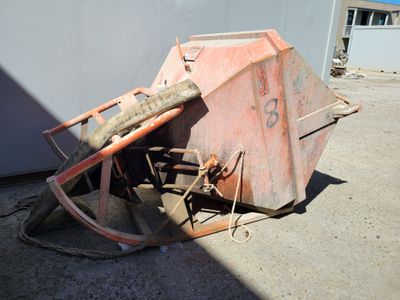 an image of a rusted out dumpster on the ground