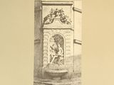 a picture of a clock on the wall of a building