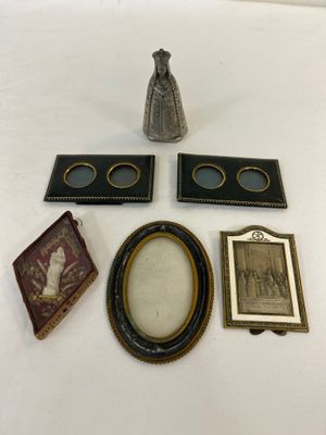 a vase, picture frame, picture, and picture on a table