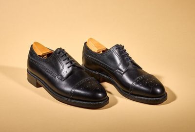the black shoes are lined up and ready to be worn