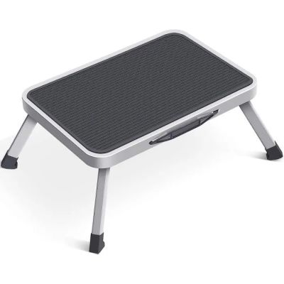 a close up of a foot stool on a white surface