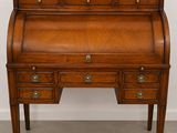 a wooden desk with drawers and drawers on top of it