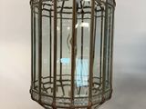 an old fashioned lantern hanging from the ceiling on a white background
