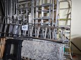 a lot of chairs that are stacked up in a room