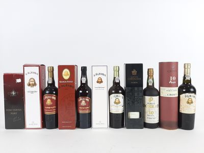 plusieurs bouteilles de vin posées les unes à côté des autres sur une surface blanche