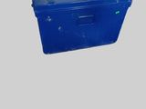 a blue plastic box with a handle on top of it