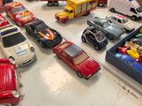 a lot of toy cars that are on the table
