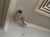 a metal pipe that is attached to the ceiling