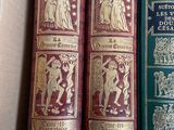 three books in a box one of which has a picture of a man and a woman on it