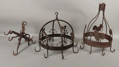 three metal birdcages with a horse on them and a horse in a cage