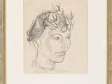 a drawing of a woman ' s face in a gold frame