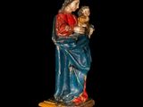 an image of a statue of a woman holding a child