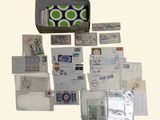 many different types of stamps and envelopes laid out on the table