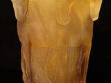 a close up of a glass vase with a horse design on it