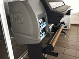a large printer that is sitting on a stand