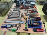 a table with many tools on it in a room