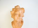 a statue of a woman that is sitting on a table