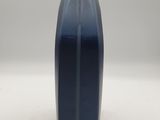 a blue water bottle sitting on top of a white table