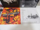 two albums of the rolling stones are sitting on a table