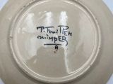a white plate with writing on it on a table