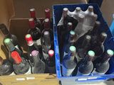 many bottles of wine in a blue box on the floor
