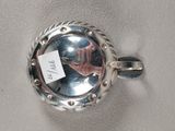 a silver plate with a picture of a person on it