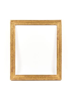 a gold frame on a white wall with a white background