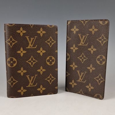 a pair of louis vuitt wallets