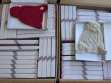 a box full of cards and a knitted hat in it