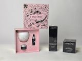 the contents of a beauty box are displayed on a white surface