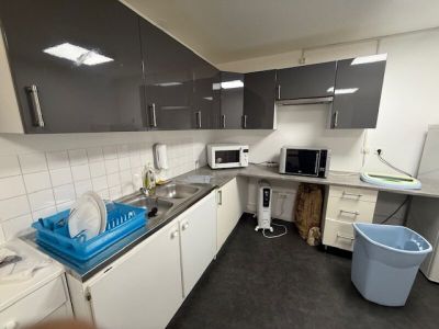 a kitchen with a sink, microwave, and dishwasher in it
