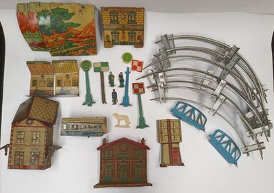 a lot of toy train tracks and buildings on the table