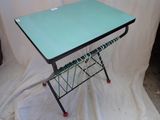 a small table with a glass top on a white sheet