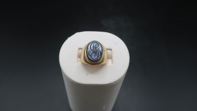 an image of a ring with a blue stone in it