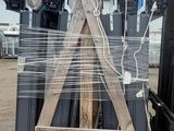 a large pile of metal and wood items on a pallet