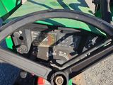 a close up of the steering wheel of a green tractor