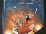 un livre sur lequel figure l'image d'un personnage de dessin animé chevauchant une vache