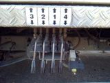 a close up of a truck ' s rear end with a number plate on it