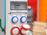 a close up of a meter on a pole in a warehouse